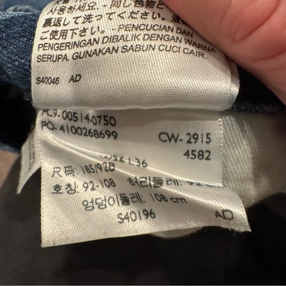 Levi's Men's 514 Straight Jeans in Medium Blue with Distressing